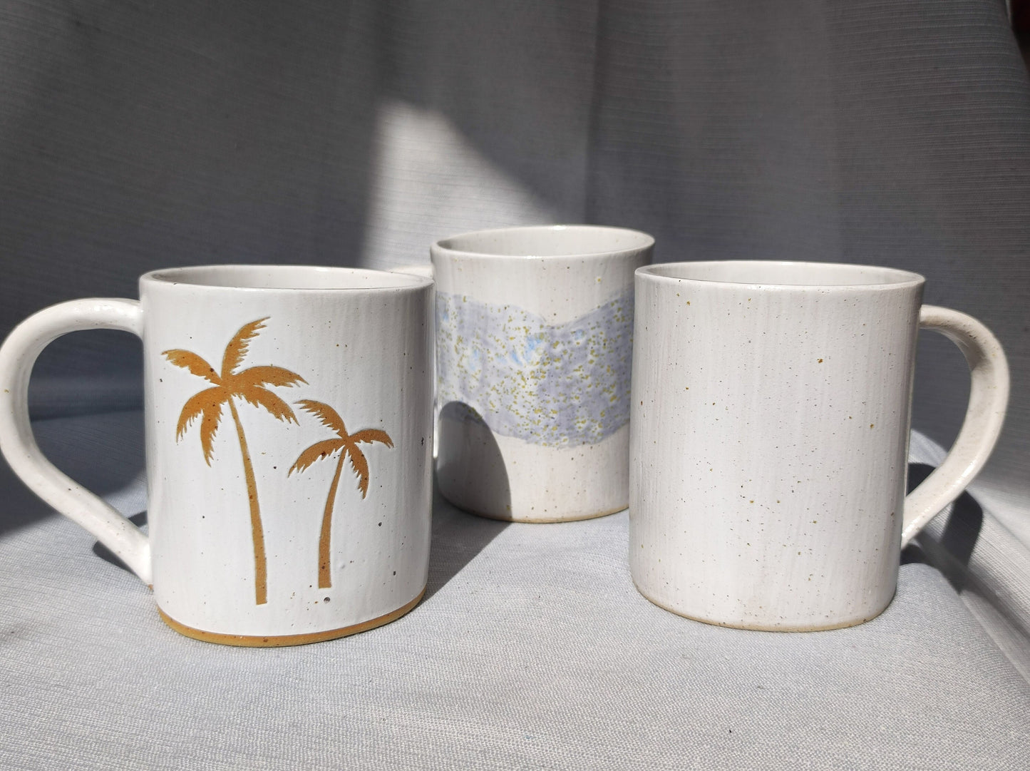 Handmade Unique Summer time mugs set (3 pcs), plain white, palm tree, and blue wave mugs.